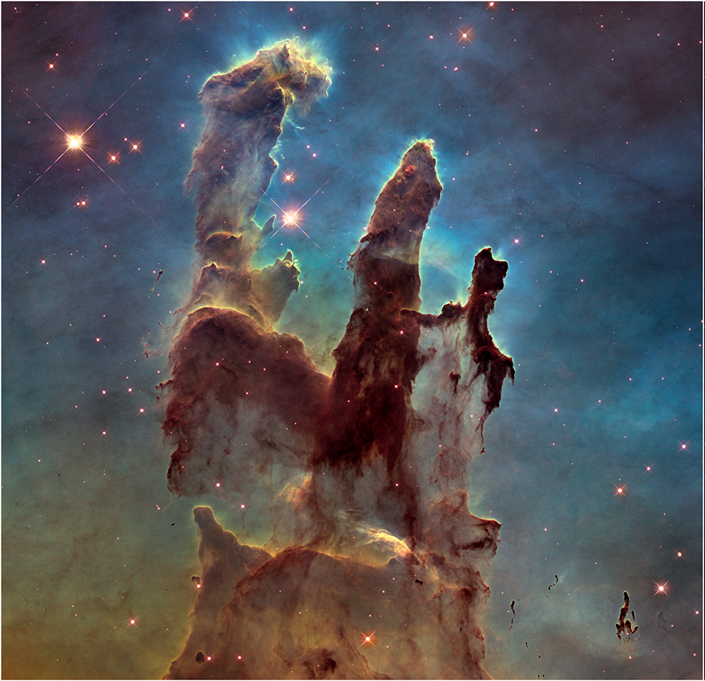 The Pillars of Creation in visible light. The dust looks thick and mostly solid, hiding most of the stars inside it.
